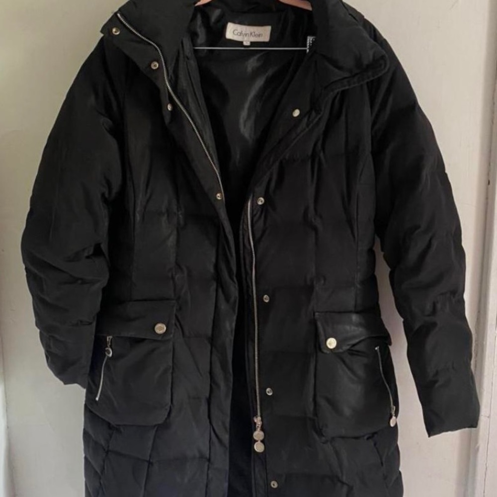 Calvin Klein black long puffer jacket with hood. Very warm for winter.